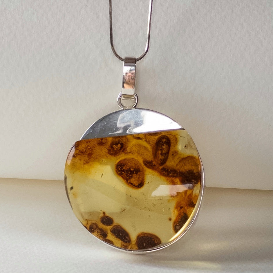 Baltic Amber Round Pendant with Natural Inclusions in Silver