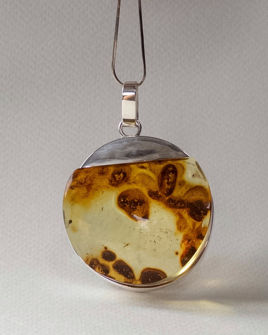 Baltic Amber Round Pendant with Natural Inclusions in Silver
