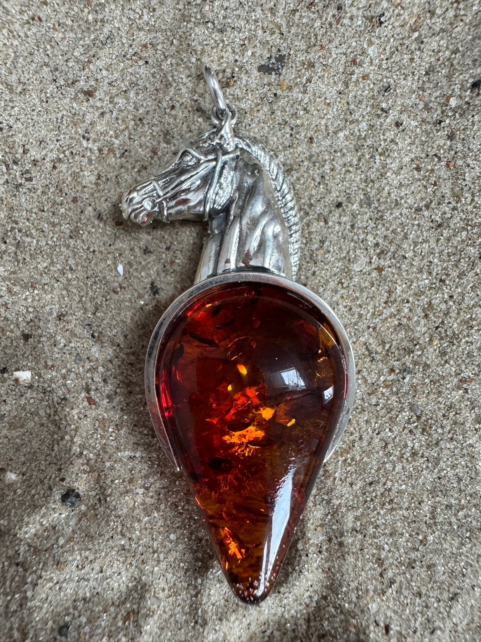 Pendant with Silver Horse Head and Cognac Amber